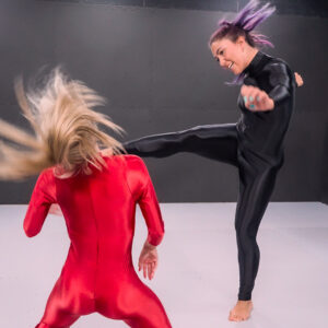 SFD805 Marzia vs Sabrina - Glossy catsuits frame a nonstop barrage of neck snaps, kicks and strikes